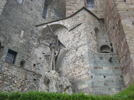 Sacra di San Michele wall and angel sculpture